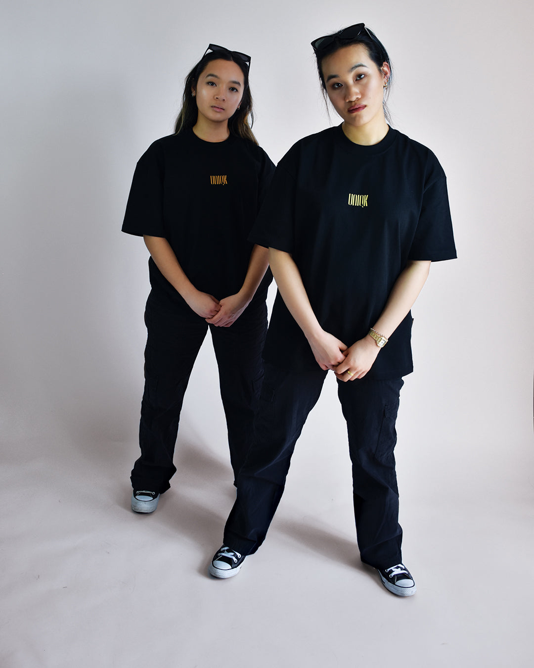 UNIQK 305gsm Melbourne Artwork Oversized Tee Orange and Yellow 100% Cotton  Female Models in photo studio front