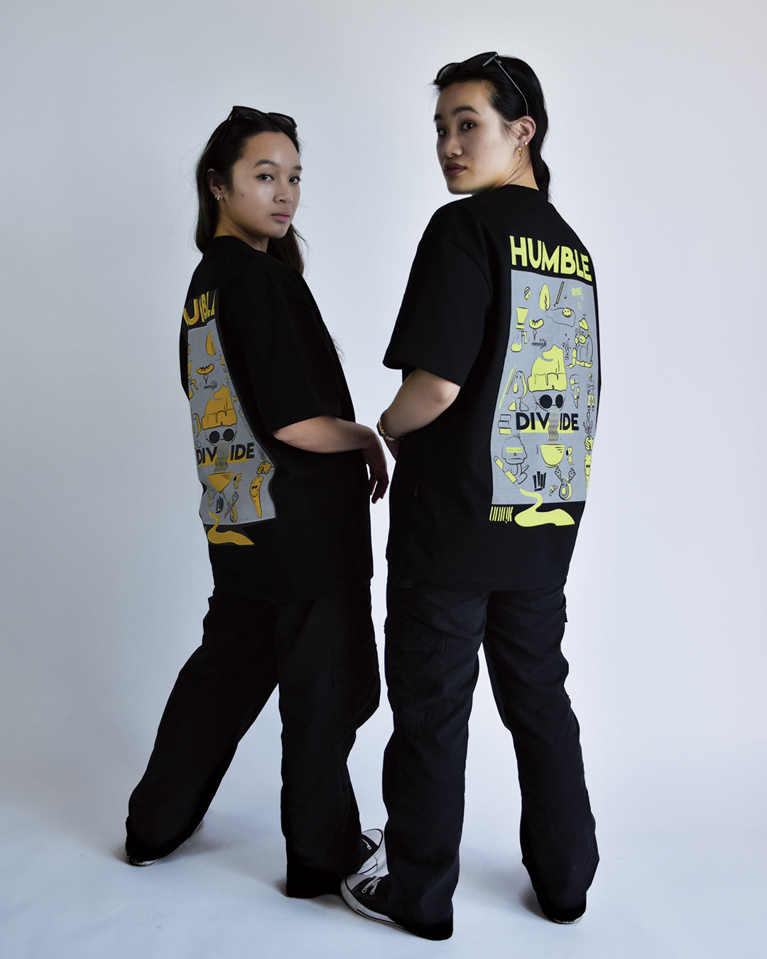 UNIQK 600gsm Melbourne Artwork Oversized Tee Black Orange and Yellow 100% Cotton Female Models Back pose in photo studio